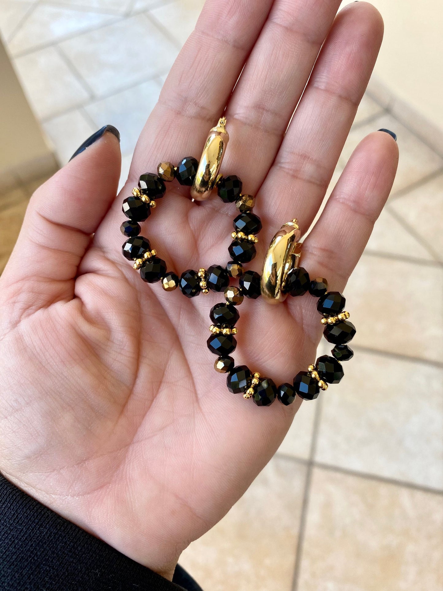 LAVA brass hoop earrings with black crystals