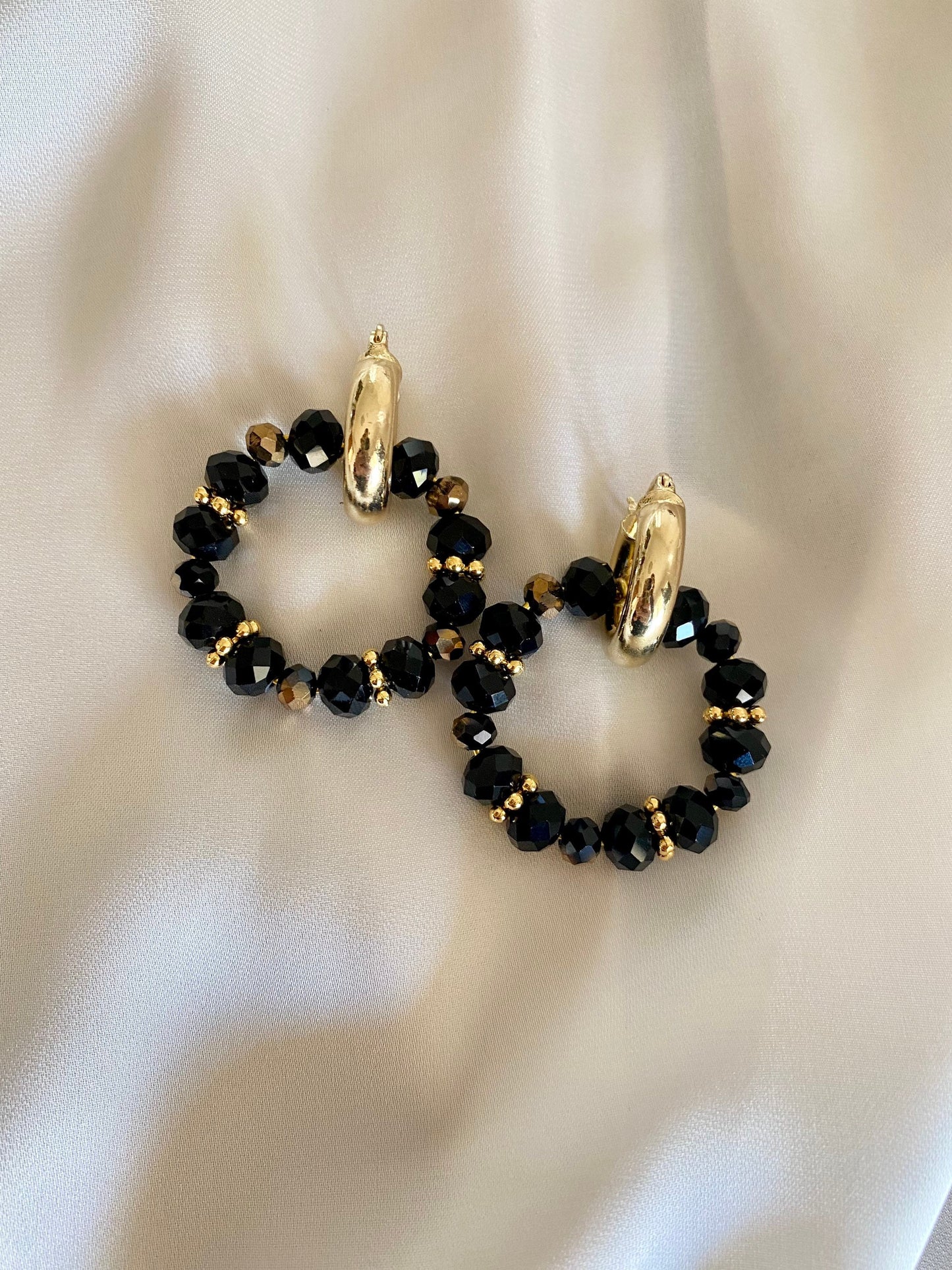 LAVA brass hoop earrings with black crystals