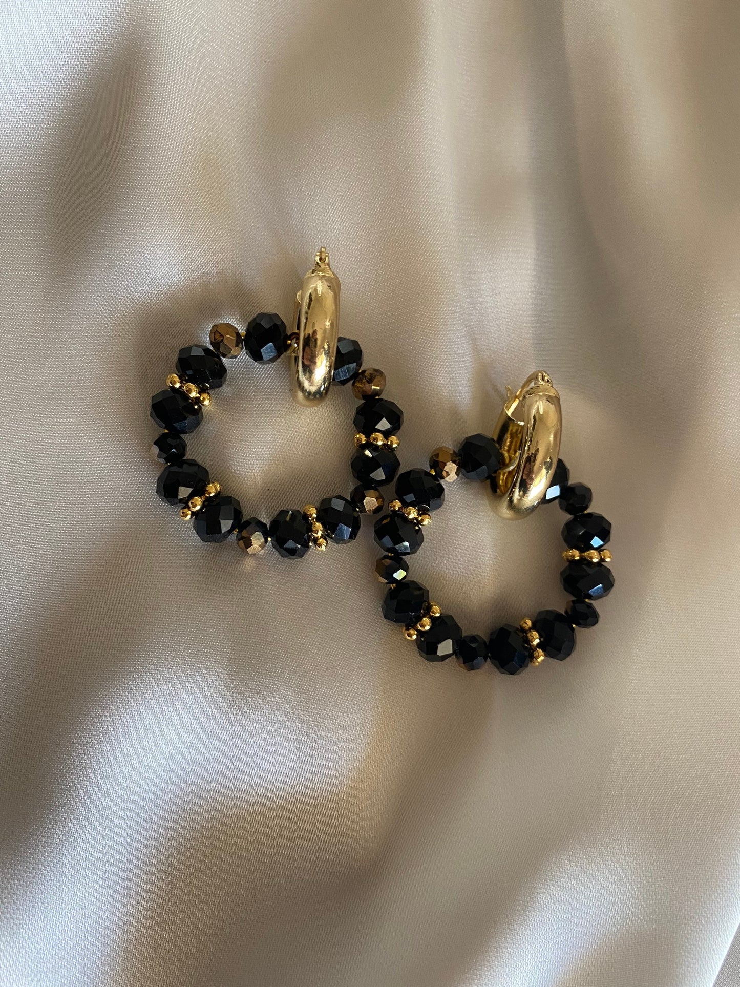 LAVA brass hoop earrings with black crystals