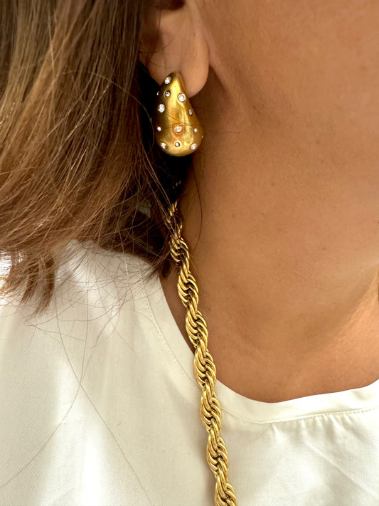 TWIST Statement gold chain necklace styled with black dress for evening outfit