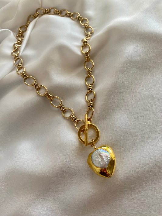 Gold plated necklace with chunky Mother of Pearl heart pendant and front toggle clasp