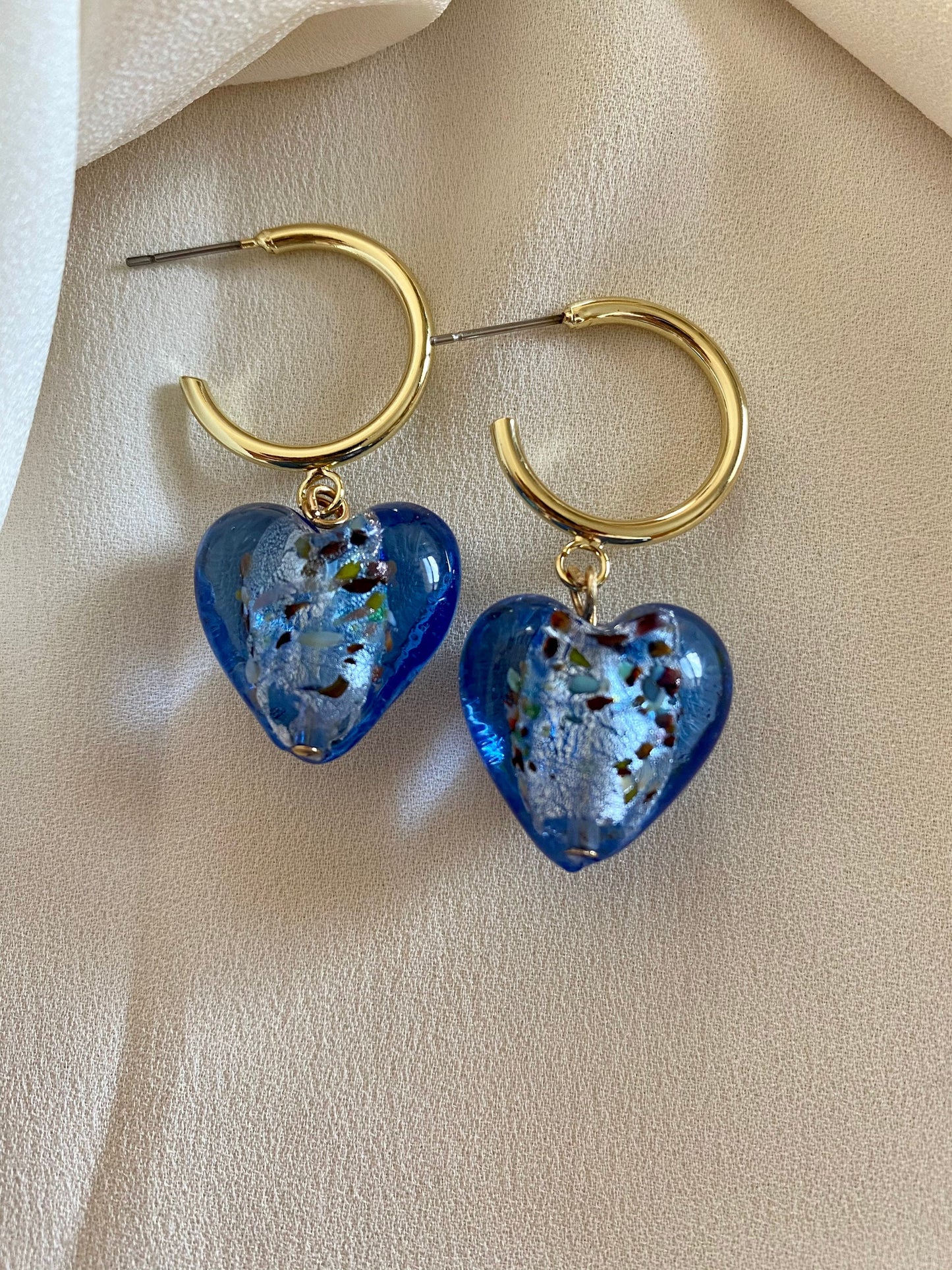Murano heart earrings on gold hoops
